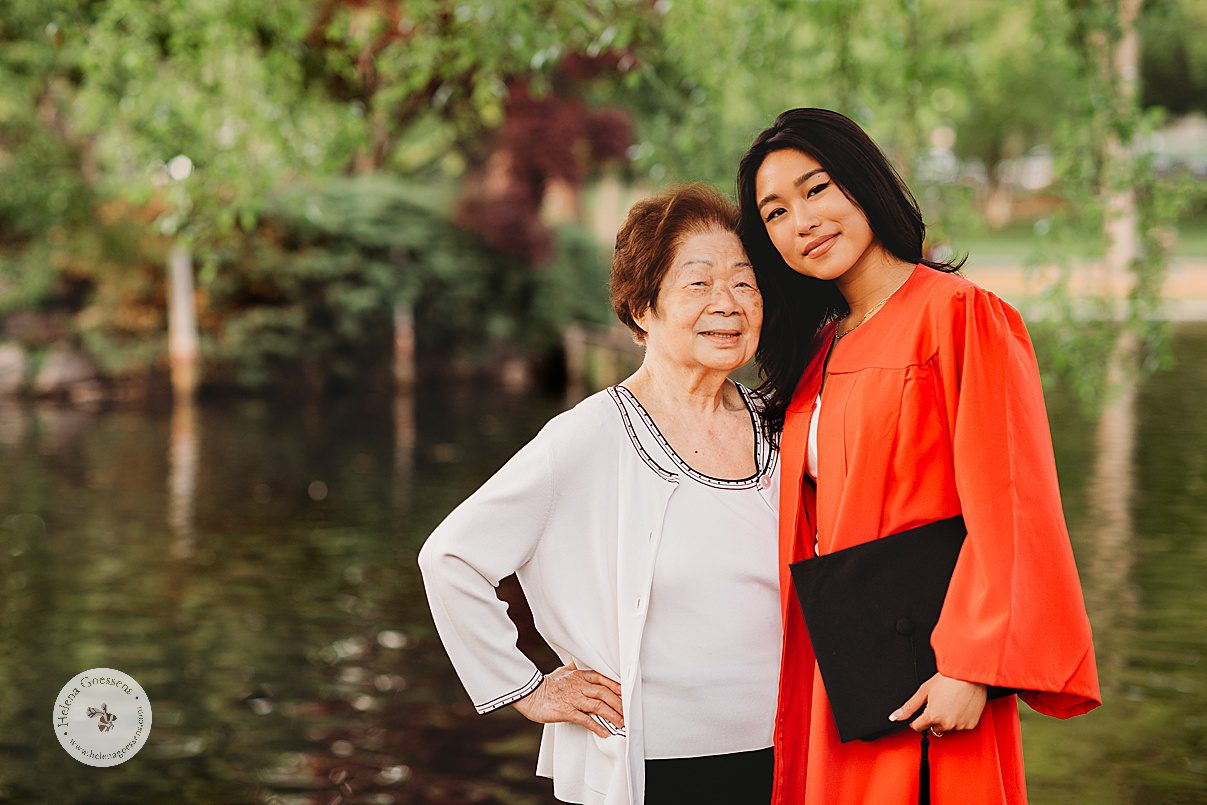 college senior stands with grandmother next to pond in Boston Public Garden 