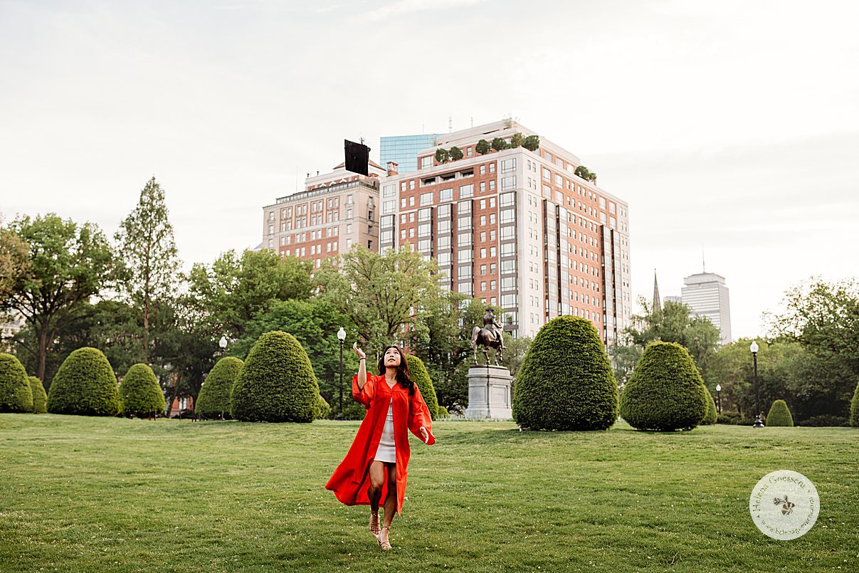 girl tosses cap in the air during Boston University graduation portraits at Boston Public Garden
