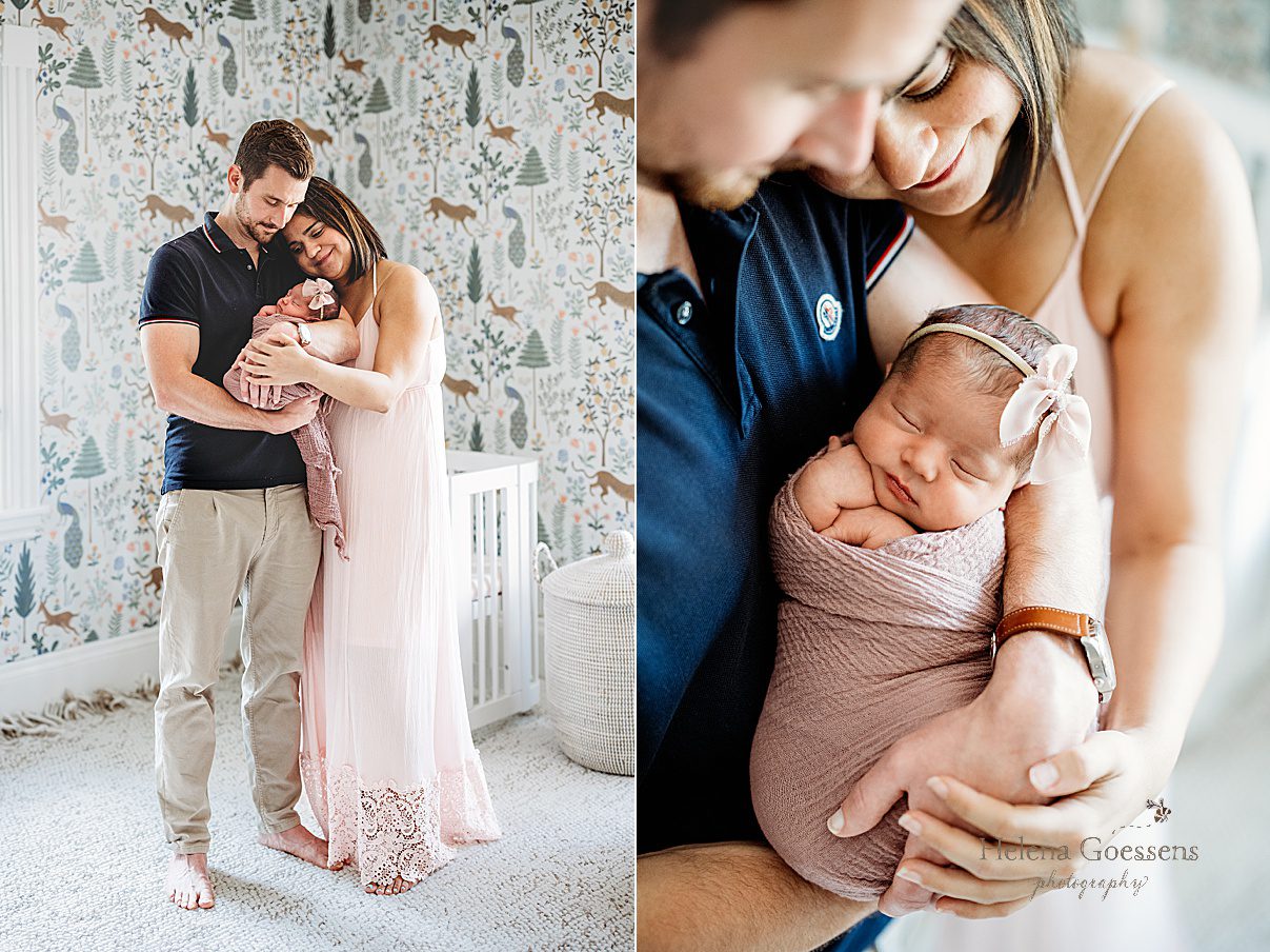 parents look down at baby girl during Dedham MA lifestyle newborn portraits while holding her in arms