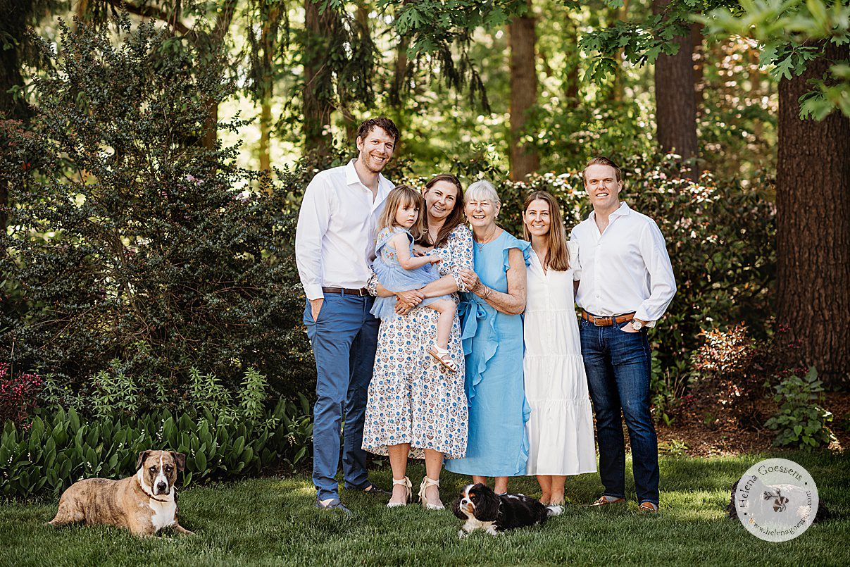 mom stands with two daughters, son-in-laws, grand daughter and dogs during Bradley Estate family photos