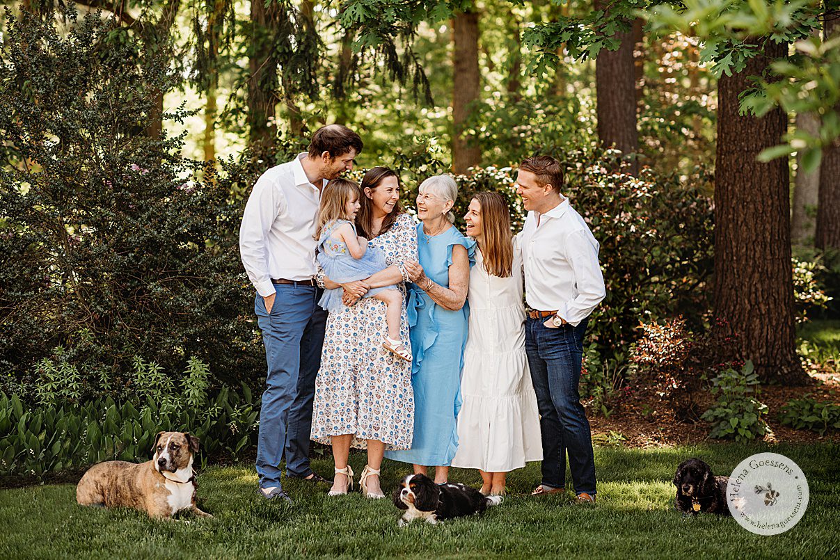 three generations smile laughing together with three dogs around them during Bradley Estate family photos