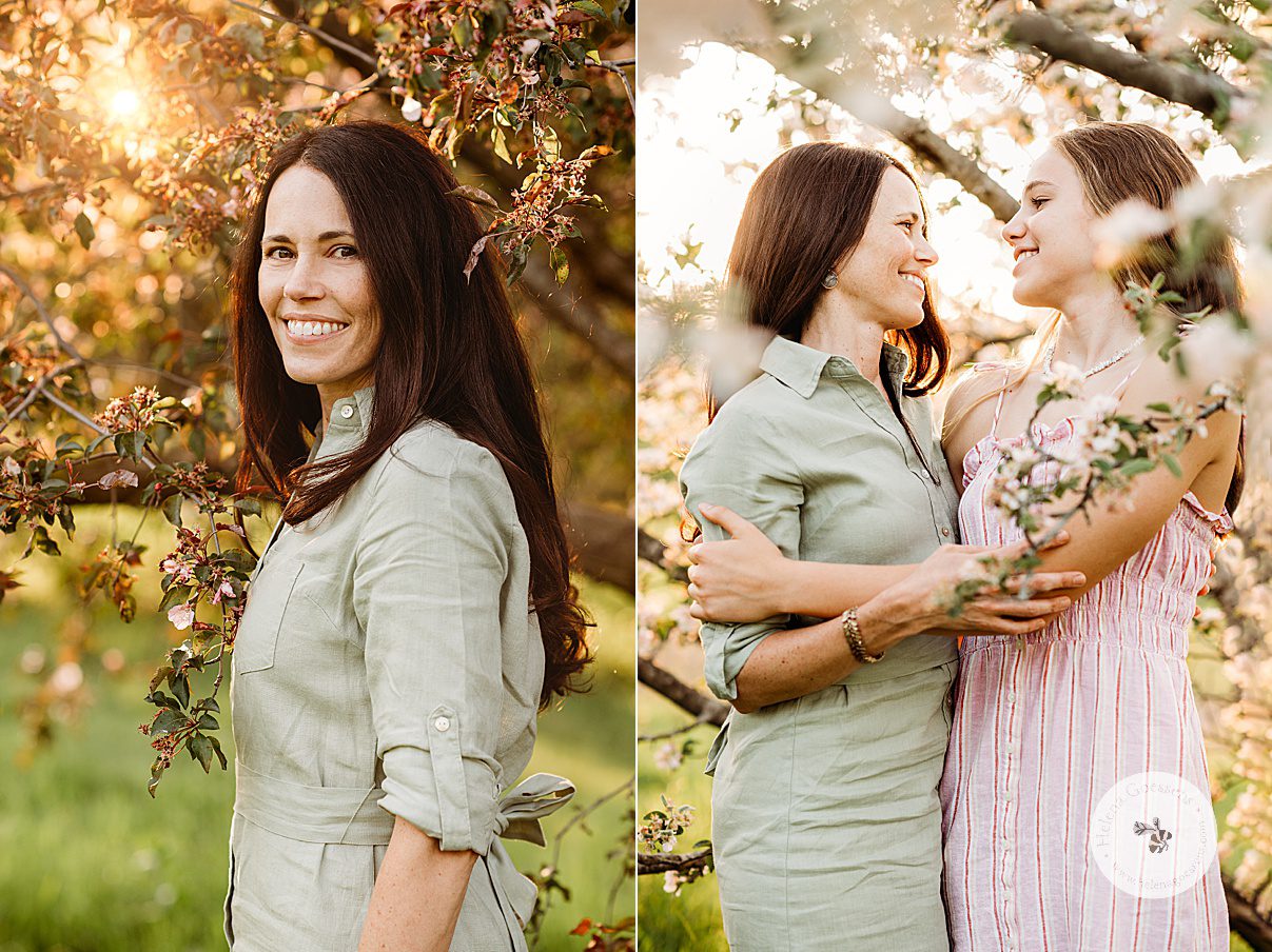 mom in pale green dress hugs daughter in pink striped dress during family photos at Arnold Arboretum