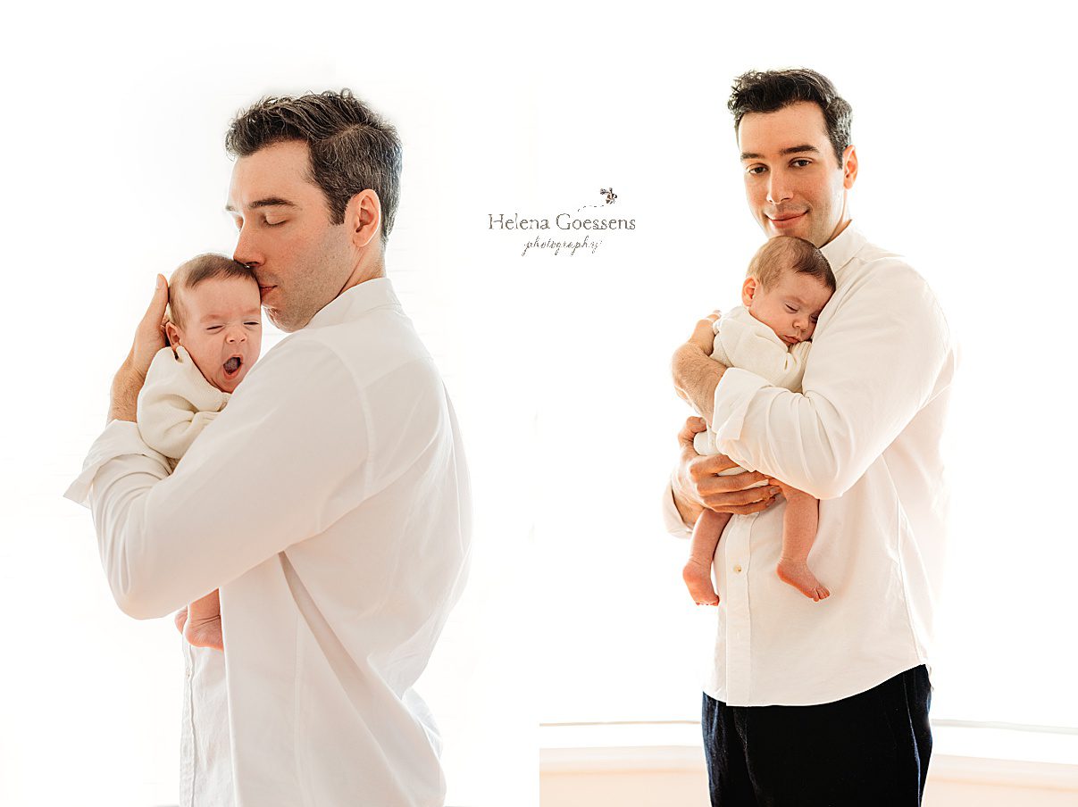 dad hugs son to chest in front of window during lifestyle newborn portraits in Westwood MA
