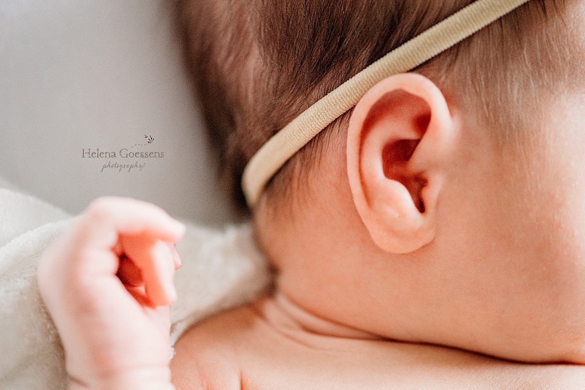 baby girl's ear with headband during Needham MA newborn photos