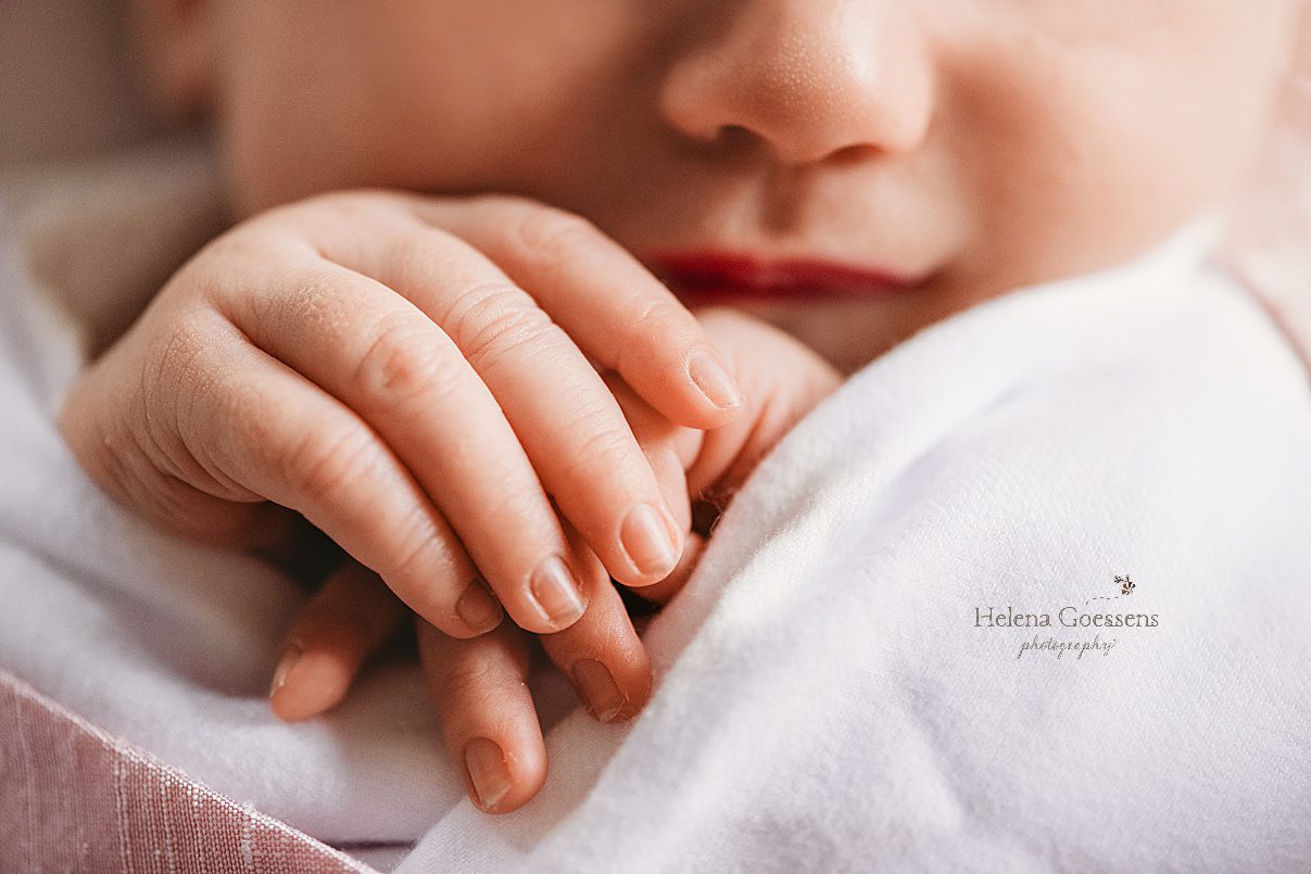 newborn baby girl's nails and tiny fingers 