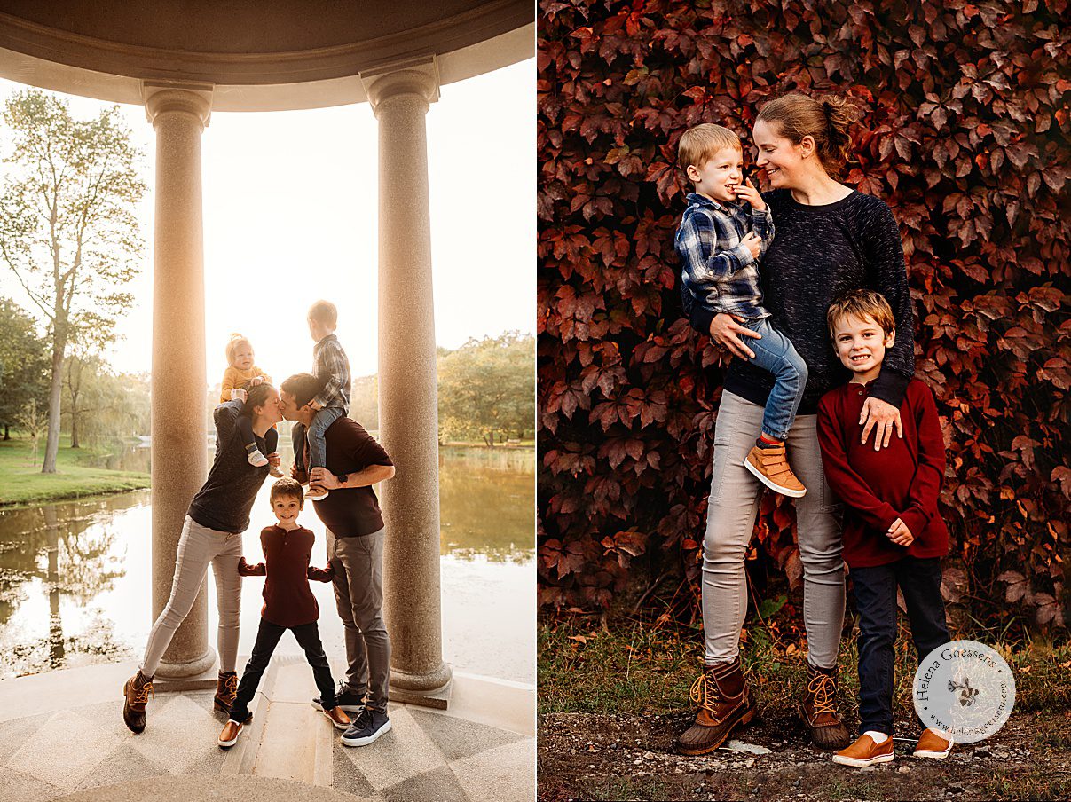mom hugs sons in front of red leaves and leans to kiss husband in front of pond during Larz Anderson Park family portraits