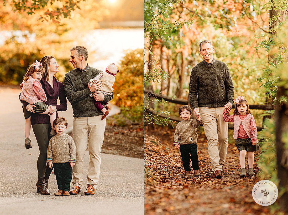 parents smile at each other holding two daughters with son standing between them during fall family portraits at Wellesley College