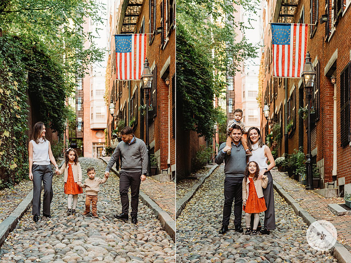 family of four walks down cobblestone street during fall family photos on Acorn Street on Beacon Hill in Boston MA 