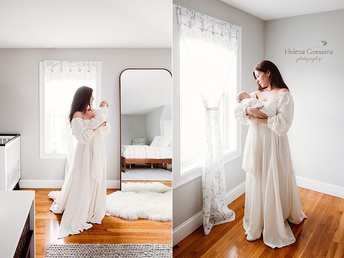 mother holds son in corner of bedroom in long flowing white dress during lifestyle newborn portraits in Waltham MA