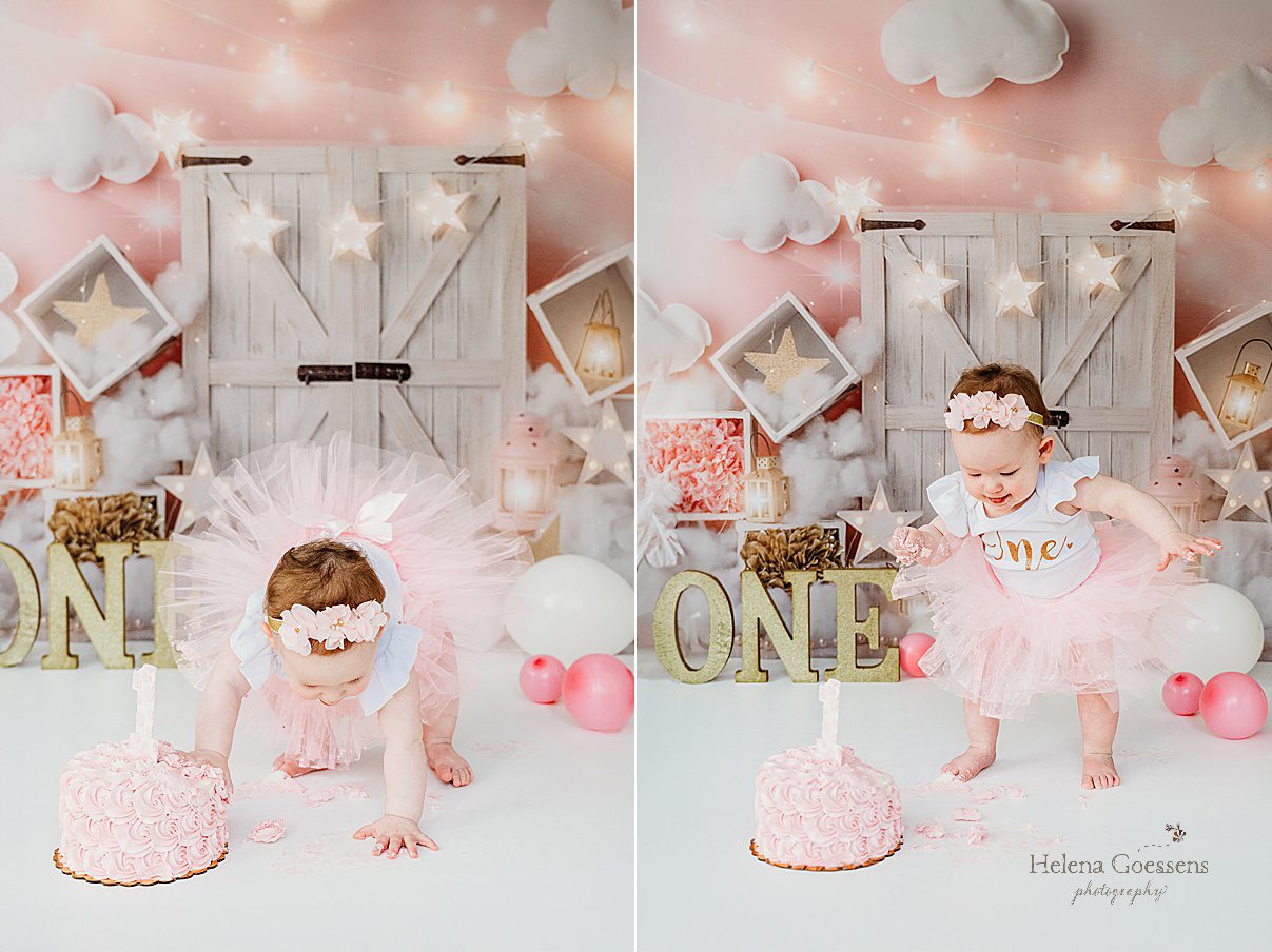 baby girl walks around cake in pink tutu during first birthday Twinkle Twinkle Little Star cake smash with pink, gold, and white details 