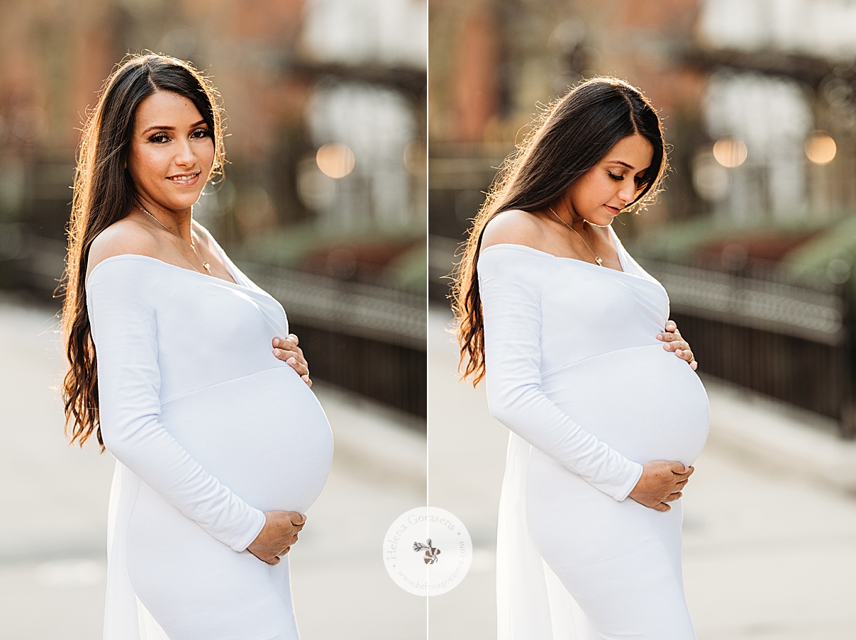 woman in white maternity gown holds baby bump standing on Commonwealth Avenue 