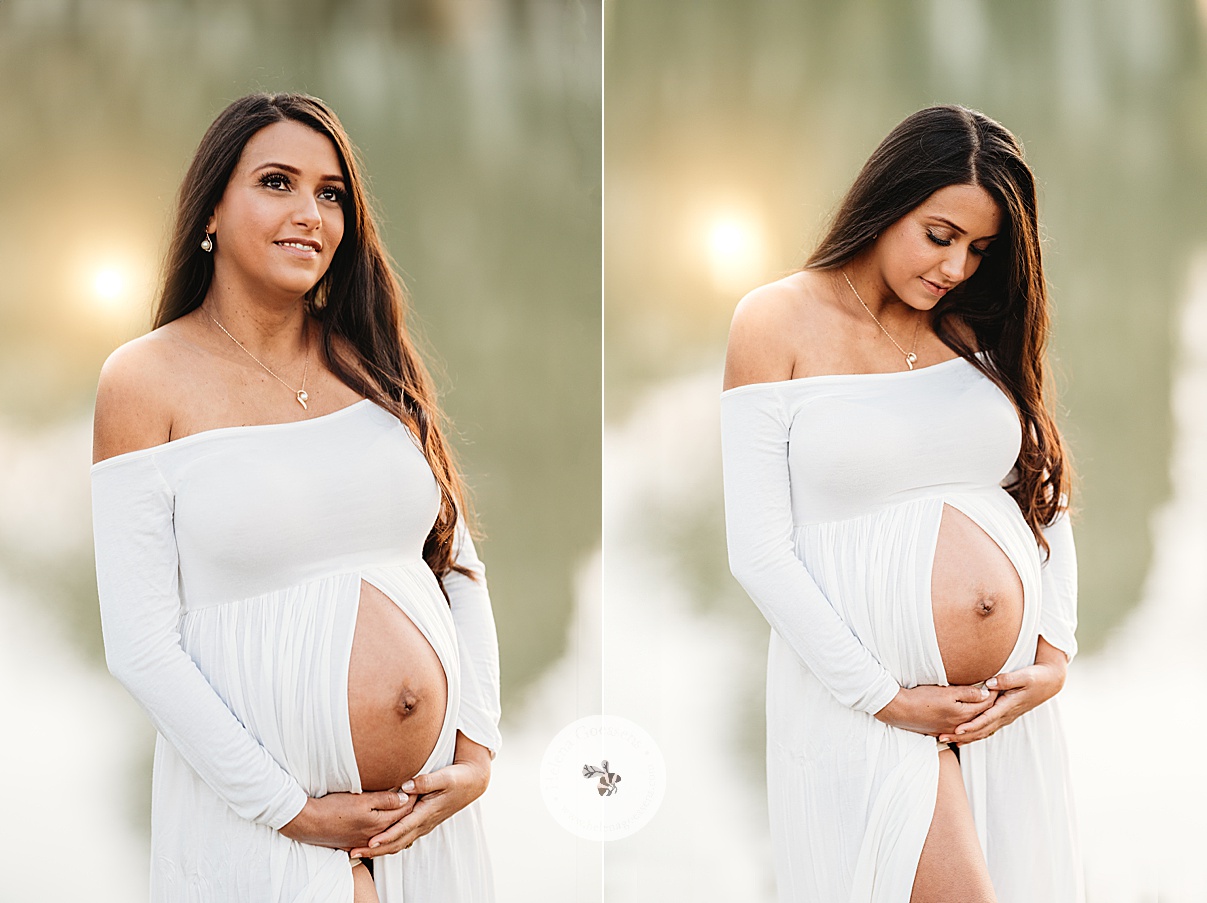 woman in white dress holds baby bump during Boston Back Bay maternity portraits
