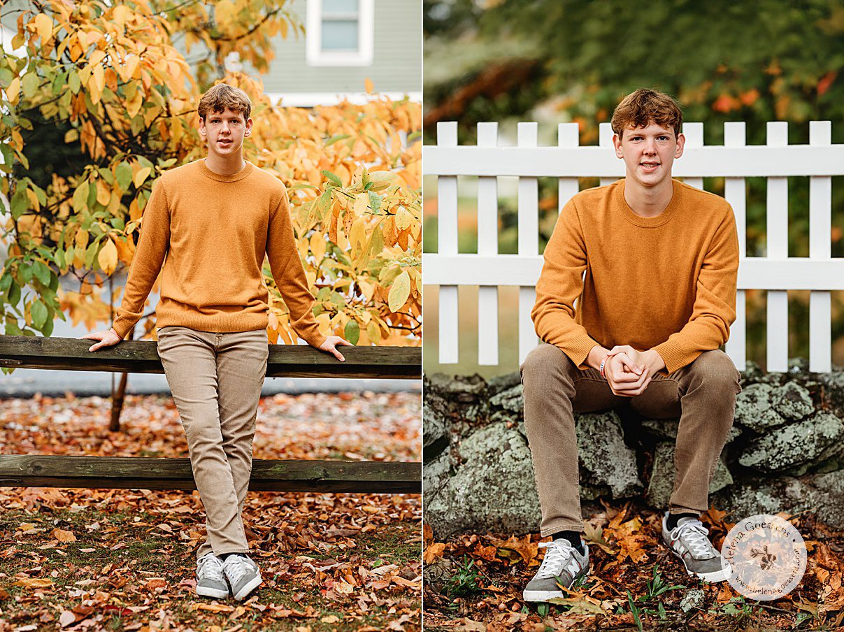 senior sits in front of white fence during portraits in Larz Anderson Park