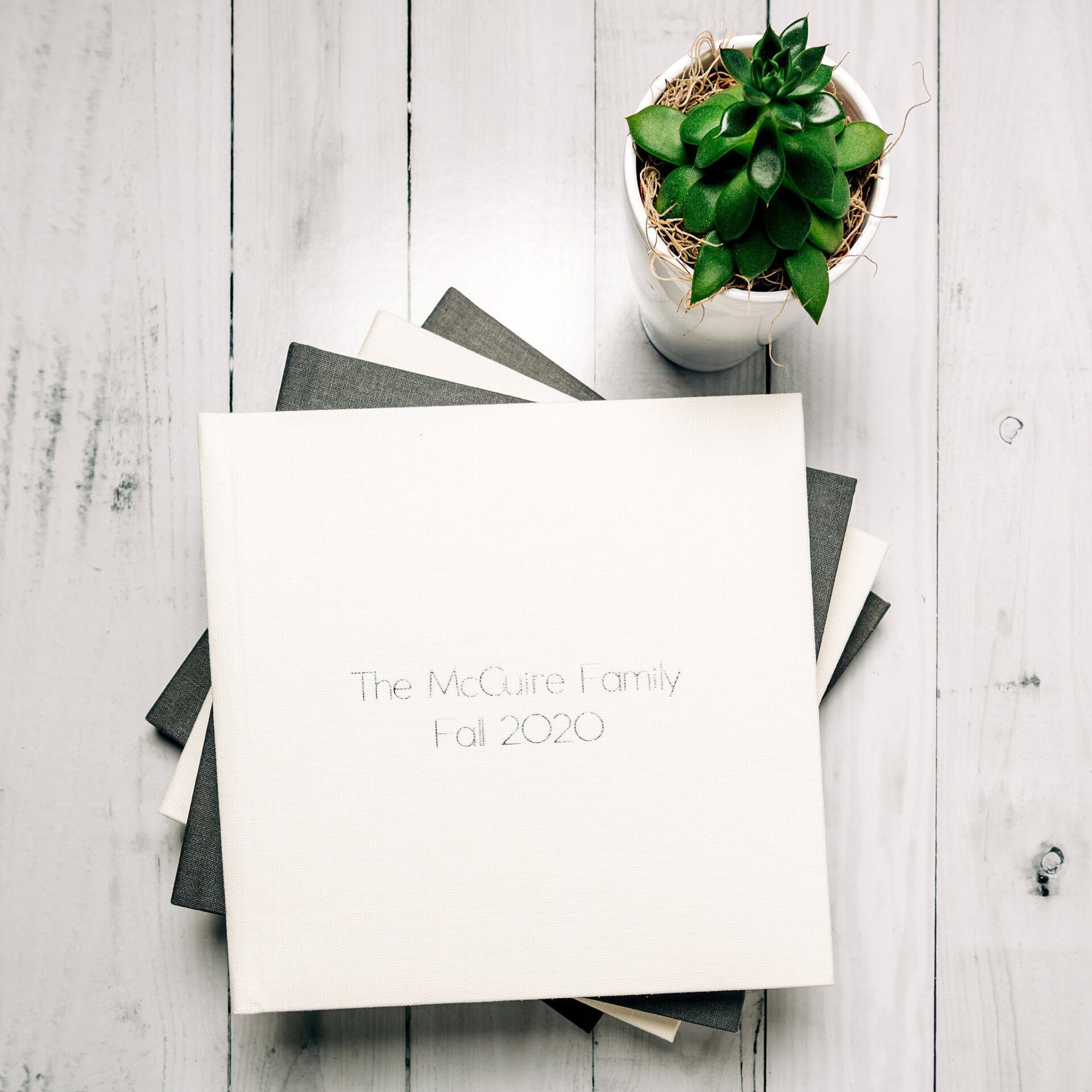 A stack of photo albums with 
